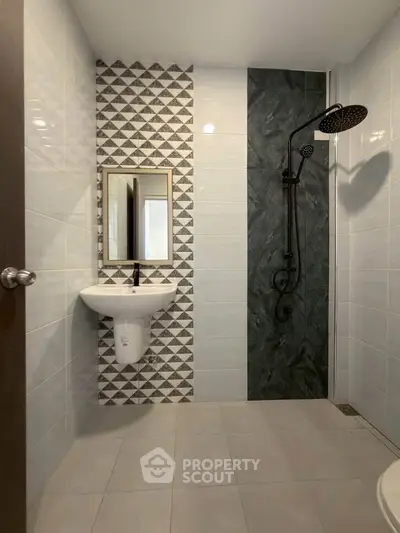 Modern bathroom with stylish tile design and sleek shower fixtures