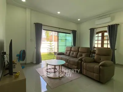 Spacious living room with modern furniture and natural light