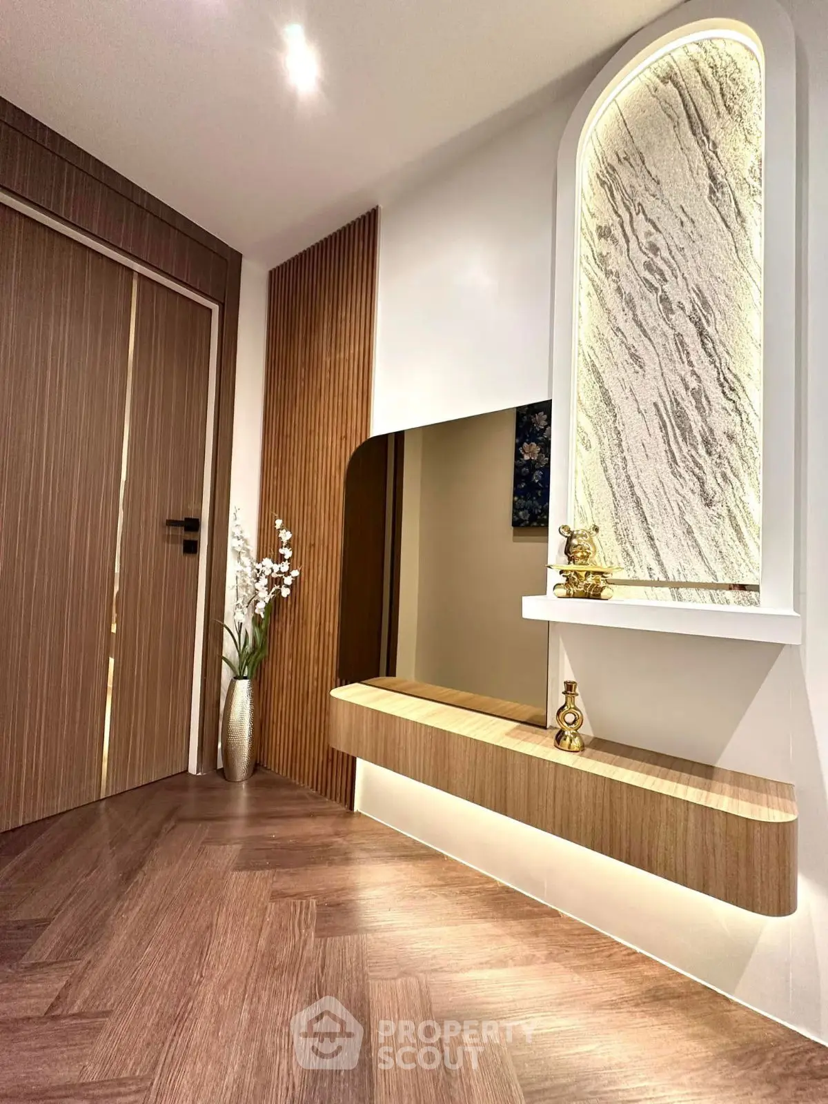 Elegant modern hallway with wooden accents and decorative lighting