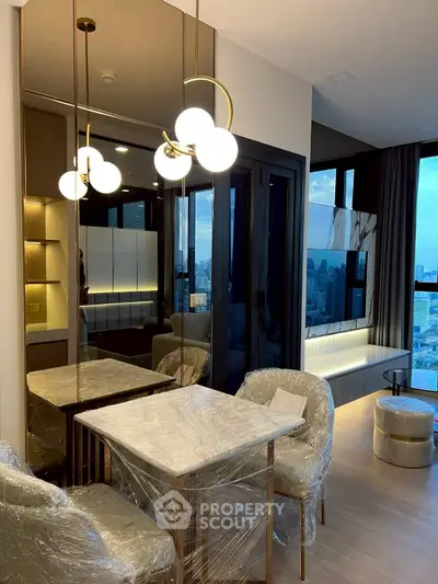 Luxurious modern living room with city view, elegant lighting, and stylish furniture.