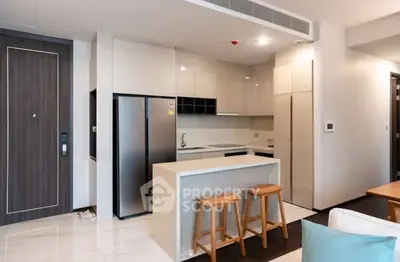 Modern kitchen with sleek design and breakfast bar in a stylish apartment.
