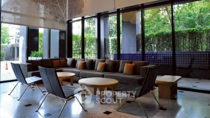 Spacious modern living room with large windows and stylish furniture