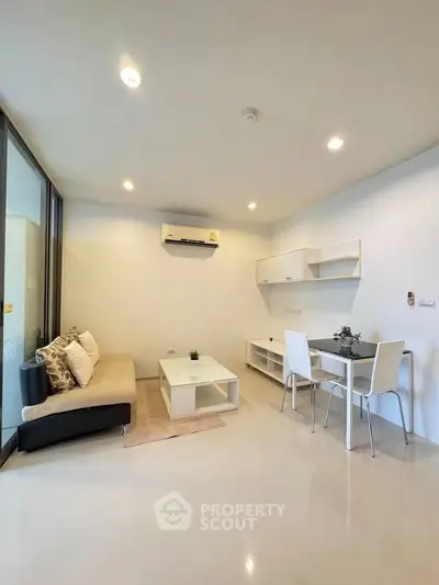 Modern living room with sleek furniture and bright lighting