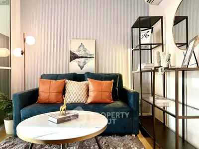Stylish living room with modern decor, plush sofa, and elegant shelving, perfect for contemporary urban living.