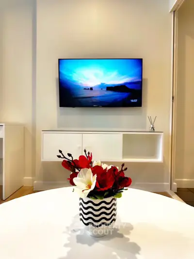 Modern living room with wall-mounted TV and stylish decor