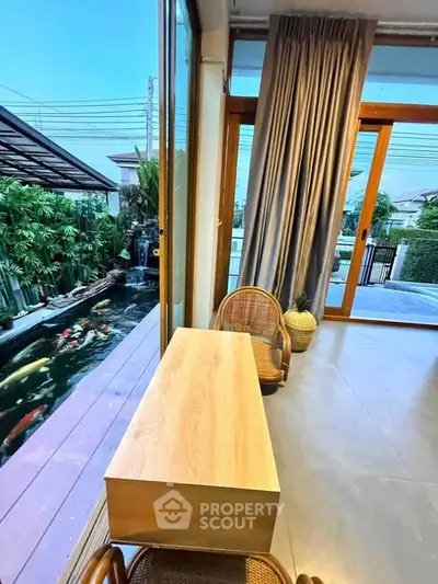 Stunning modern home with koi pond view from elegant interior space