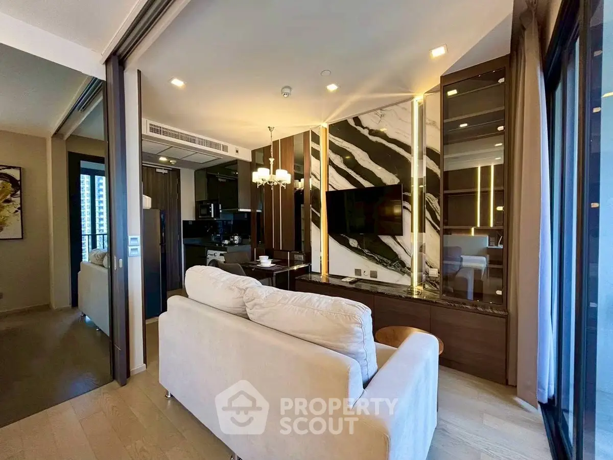 Luxurious modern living room with elegant decor and large windows