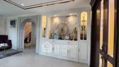 Elegant living room with built-in display cabinet and luxurious decor