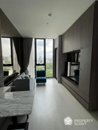 Sleek modern living room with floor-to-ceiling windows offering a panoramic city view, complemented by dark wood cabinetry and chic furnishings.