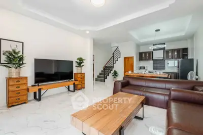 Spacious modern living room with open kitchen and stylish decor