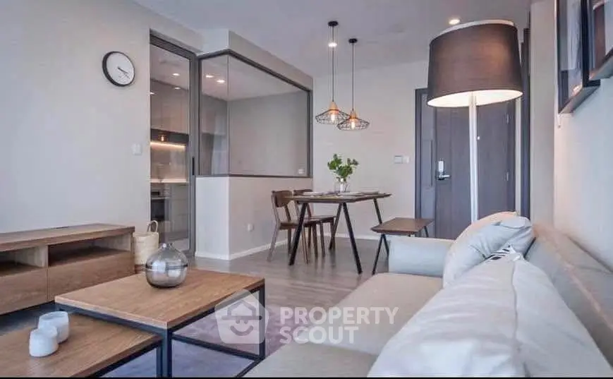 Modern living room with stylish decor and open kitchen layout