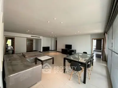 Spacious modern living room with sleek furniture and open layout