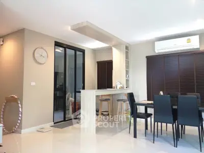 Modern dining area with stylish bar counter and elegant decor