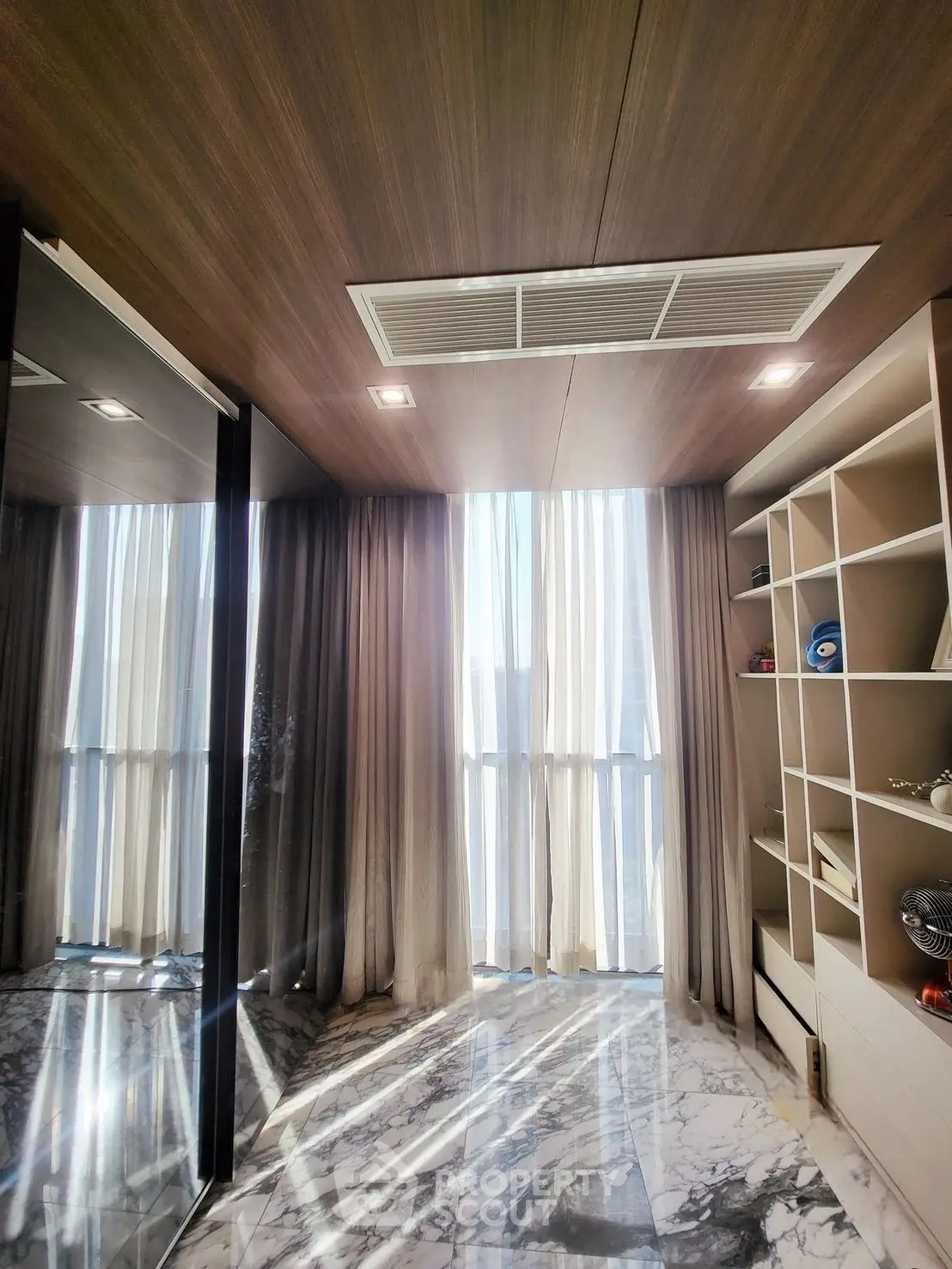 Luxurious modern room with marble flooring and floor-to-ceiling windows