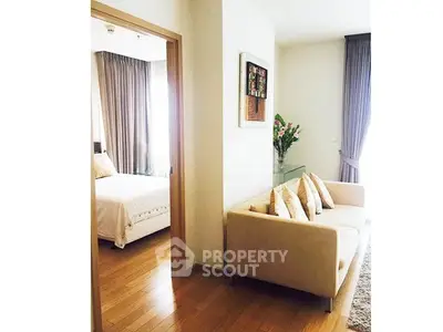 Bright and cozy apartment interior with elegant living room and inviting bedroom.