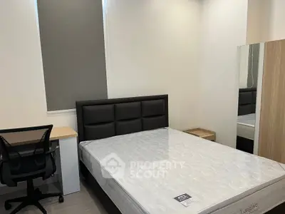 Modern bedroom with sleek furniture and comfortable mattress, ideal for restful nights.