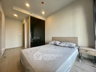 Modern minimalist bedroom with sleek design and ample natural light