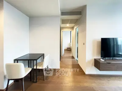 Modern living room with sleek furniture and wooden flooring