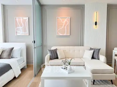 Modern living room with elegant decor and cozy seating area