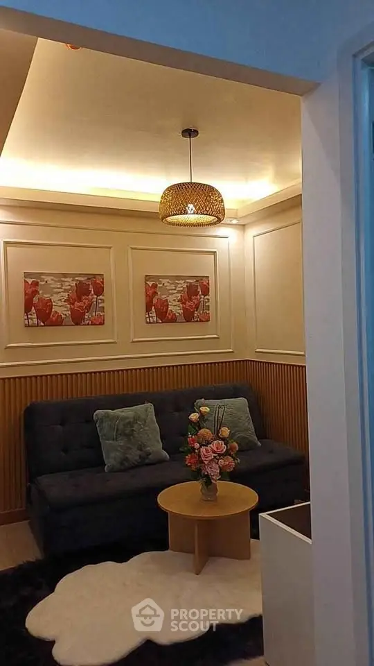 Cozy living room with stylish decor and ambient lighting, perfect for relaxation and entertaining guests.