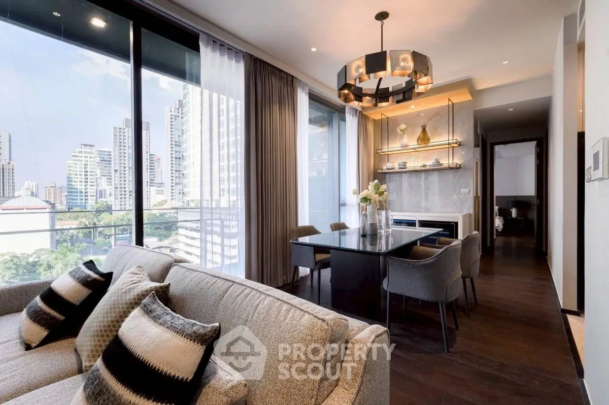 Luxurious modern living room with city view, elegant dining area, and stylish decor in high-rise apartment.