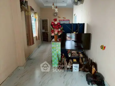 Spacious living room with modern decor and large TV setup