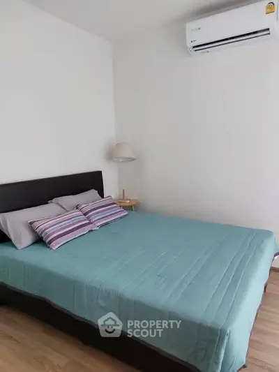 Cozy bedroom with modern air conditioning and stylish decor