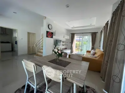 Spacious modern living room with dining area and natural light