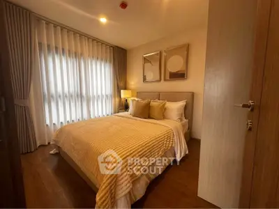 Cozy bedroom with warm lighting and elegant decor in modern apartment.