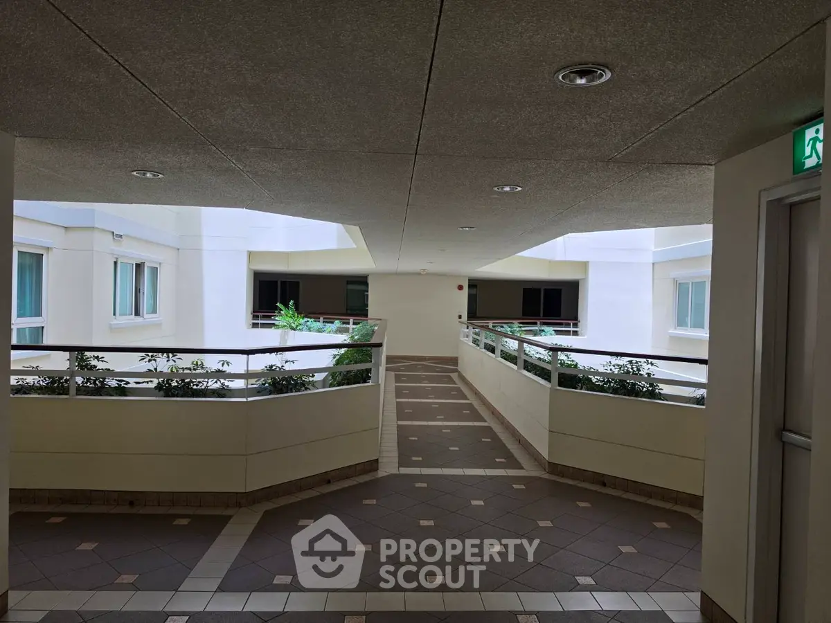 Modern apartment building corridor with stylish design and natural light