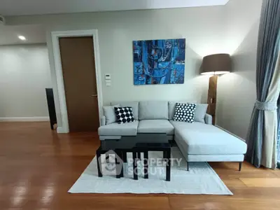 Modern living room with stylish decor and comfortable seating in a contemporary apartment.