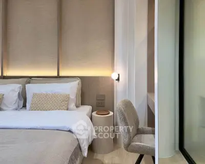 Luxurious modern bedroom with elegant decor and cozy lighting, perfect for relaxation and comfort.