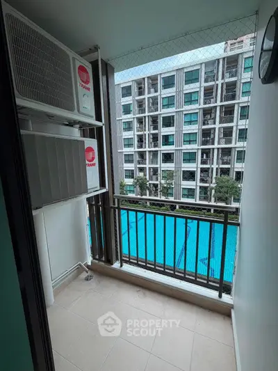 Modern balcony with pool view in urban apartment complex