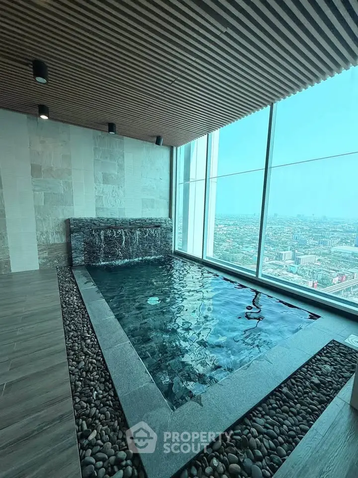 Luxurious indoor pool with stunning city view and modern design