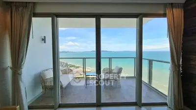 Stunning ocean view from modern balcony with elegant seating area