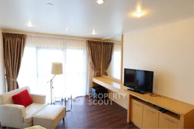 Spacious living room with modern decor and natural light