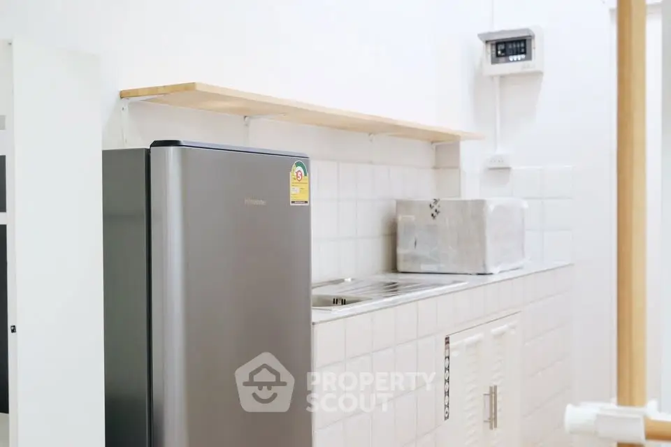 Modern kitchen with sleek fridge and minimalist design