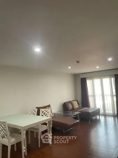 Spacious living room with modern furniture and large windows for natural light.