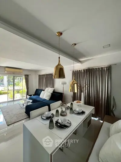 Modern living room with elegant dining area and stylish decor