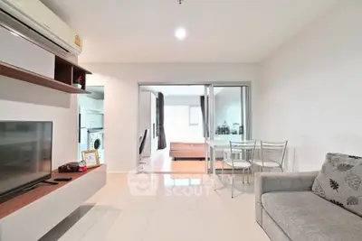 Modern living room with open layout and stylish furniture in a bright apartment.
