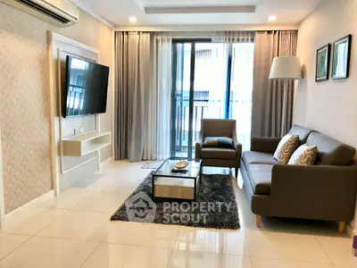 Modern living room with sleek furniture and large window in a stylish apartment.