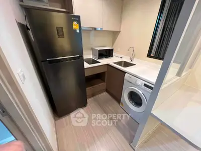 Modern compact kitchen with sleek appliances and efficient layout