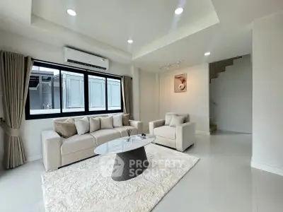 Spacious modern living room with elegant furniture and natural light