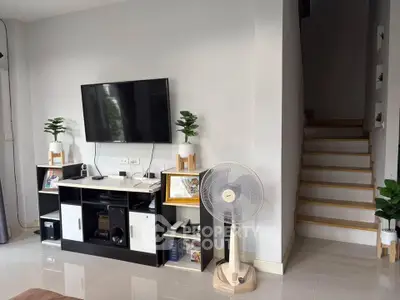 Modern living room with sleek TV setup and stylish decor