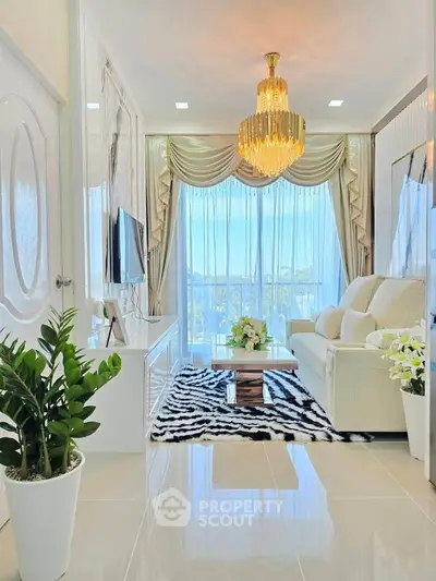 Luxurious living room with elegant chandelier and stunning city view