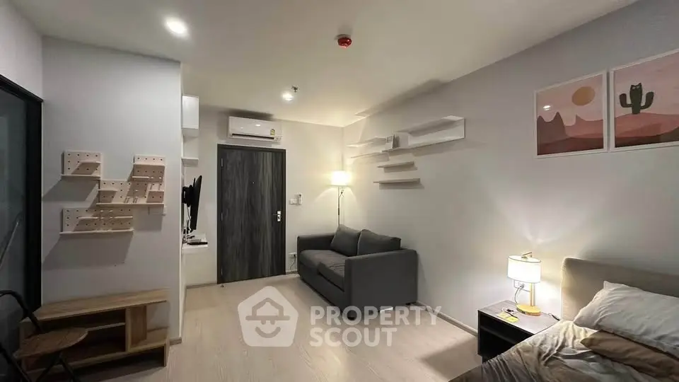 Modern living room with stylish decor and cozy ambiance in a contemporary apartment.