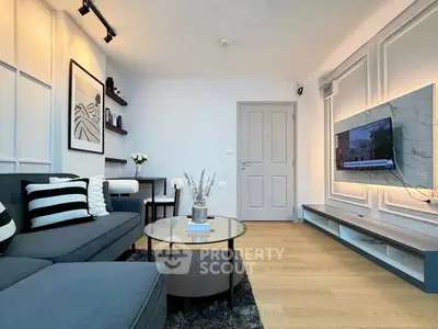 Modern living room with stylish decor and wall-mounted TV