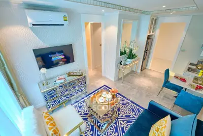 Luxurious living room with elegant decor and modern amenities in a stylish apartment.