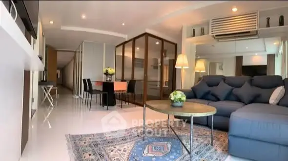 Spacious modern living room with elegant decor and ample natural light