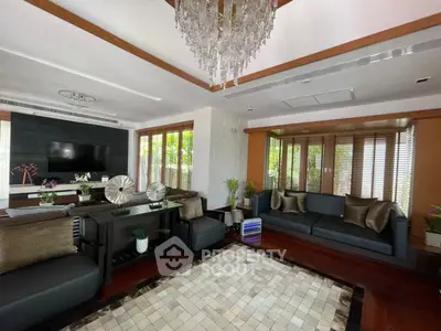 Luxurious living room with elegant decor and large windows offering natural light